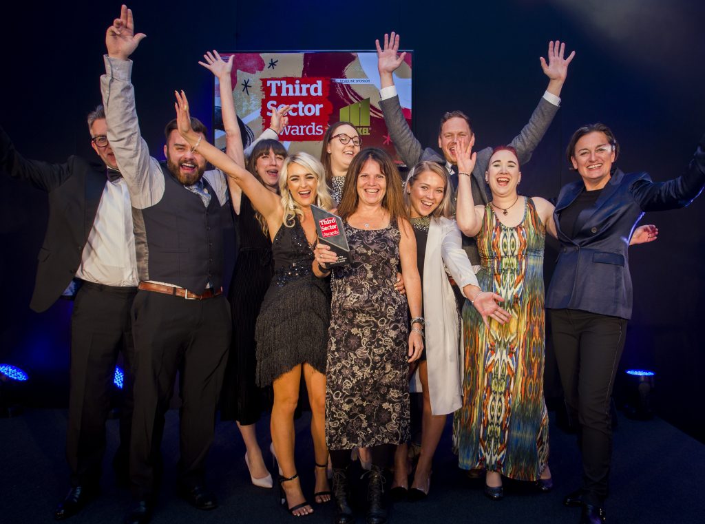 SLF staff and trustees celebrating being presented with the Charity of the Year Award at the Third Sector Awards 2019.